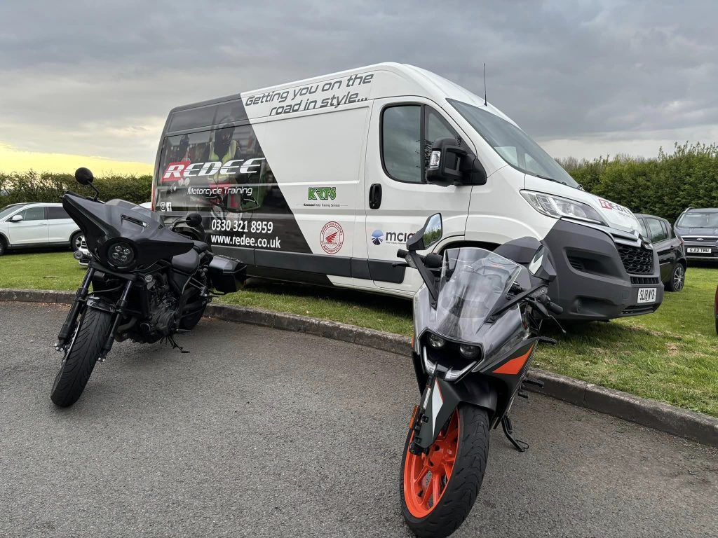 The finished Redee Motorcycle Training van graphics with two motorcycle infront